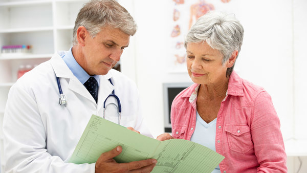 doctor giving patient medical results